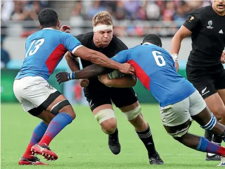 ?? GETTY IMAGESthe ?? Sam Cane tries to break through the tackles of Justin Newman and Prince Gaoseb during the World Cup pool match against Namibia in Japan last year.