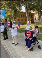  ?? Giuseppe Ricapito
/ Union Democrat ?? Chris and Joan Montesano of Sonora hold up signs at a demonstrat­ion on Tuesday against the recall effort (above). A sample ballot for the Sept. 14 recall election of Gov. Gavin Newsome includes 46 names (right).