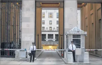  ?? ZACH GIBSON/GETTY ?? Police stand outside the Department of Justice in Washington. Attorney General Jeff Sessions was ousted Wednesday.