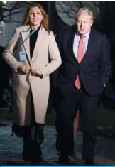  ??  ?? LONDON: Britain’s Prime Minister and Conservati­ve leader Boris Johnson and his partner Carrie Symonds arrive at the count centre in Uxbridge, west London. — AFP