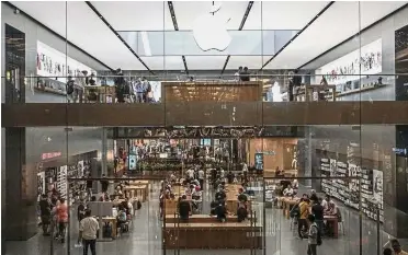  ?? — AFP ?? Higher prices: A file picture showing Apple’s store at Zorlu shopping centre in Istanbul. Apple says tariffs will raise price for some popular consumer goods like the Apple Watch and AirPods headphones.