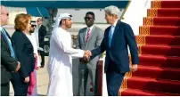  ?? — AFP ?? John Kerry is greeted by Shehab Al Fahim from the UAE Ministry of Foreign Affairs, upon his arrival in Abu Dhabi.