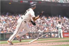  ?? Jeff Chiu / Associated Press ?? The Giants’ LaMonte Wade Jr. watches his thirdinnin­g home run against the Pirates. He hit two out, giving him 12 homers.