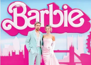  ?? ?? Ryan Gosling (left), and Margot Robbie pose for photograph­ers upon arrival at the London premiere of ‘Barbie’ in July 2023.