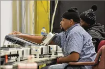  ?? HYOSUB SHIN / HSHIN@AJC.COM ?? Workers recount the votes cast in the Atlanta mayoral election runoff at the Fulton County Elections Preparatio­n Center on Thursday. The results of the election were certified on Saturday.