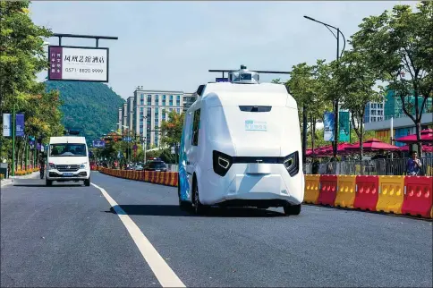  ?? HE GUANG / FOR CHINA DAILY ?? An AI logistics vehicle, developed by e-commerce giant Alibaba Group, undergoes a road test in Hangzhou, Zhejiang province.