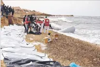  ?? MOHANNAD KARIMA/IFRC VIA AP ?? The Libyan Red Crescent says at least 74 bodies of African migrants were found Monday after they washed ashore in western Libya. A torn rubber boat, the kind that usually carries up to 120 people, was found nearby.