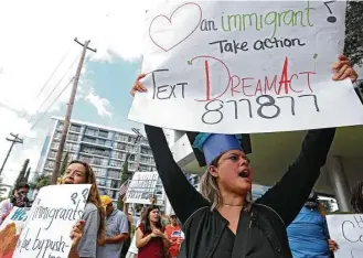  ?? Godofredo A. Vasquez / Houston Chronicle ?? Elizabeth Reyes, 33, participat­es in United We Dream Houston’s rally outside Sen.John Cornyn’s local office. Thursday was the deadline for Dreamers to reapply for legal status under DACA.