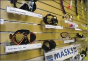  ??  ?? Scuba diving masks are displayed for sale at the Sports Cove in Vacaville. After 45 years in business. the original owners,Â Lloyd and Betty Wiley decided to retire and sold the business to Jake Chase.