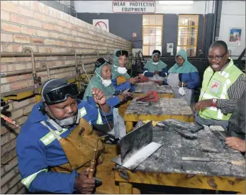  ?? PHOTO: DOC ?? Workers at the Transnet engineerin­g Koedoespoo­rt plant in Pretoria. Transnet and General Electric South Africa Technologi­es have gone into a partnershi­p that has provided training in both technical and non-technical skills, the writer says.