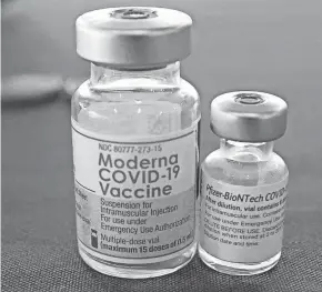  ?? ROGELIO V. SOLIS/AP ?? Billions more in profits are at stake for vaccine makers Moderna and Pfizer as the U.S. moves toward dispensing COVID-19 booster shots.