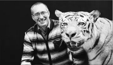  ?? — ESF photo ?? Study co-author Mikhail Paltsyn with the taxidermie­d specimen of what is believed to be an Amur tiger.