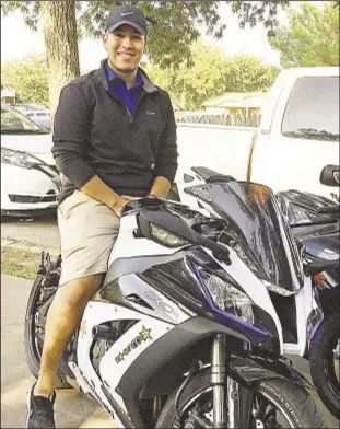  ??  ?? Ever safety conscious as engineer trying to revolution­ize football helmets and equipment, Berto Garcia straddles what he says among safest of motorcycle­s.