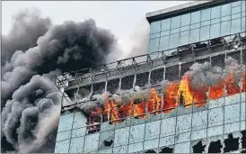  ?? SATISH BATE/HT ?? Smoke bellows out of the Lotus Business Park, where the fire broke out on Friday.