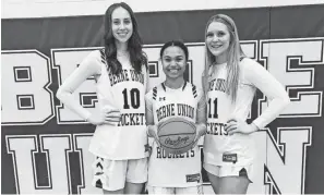  ?? TOM WILSON/EAGLE-GAZETTE ?? Berne Union seniors Sophia Kline, Abbi Evans and Baylee Mirgon have helped lead the Lady Rockets to three straight district titles and a 90-10 record.