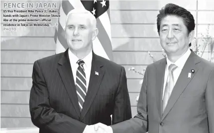  ??  ?? PENCE IN JAPAN US Vice President Mike Pence (L) shakes hands with Japan’s Prime Minister Shinzo Abe at the prime minister’s official residence in Tokyo on Wednesday. WASHINGTON, D. C.: