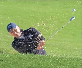  ?? KYLE TERADA/USA TODAY SPORTS ?? PGA Tour Commission­er Jay Monahan hits out of a bunker during the AT&amp;T Pebble Beach Pro-Am tournament last month.