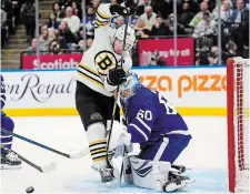  ?? FRANK GUNN THE CANADIAN PRESS FILE PHOTO ?? Boston Bruins left-winger Brad Marchand screens Maple Leafs goaltender Joseph Woll in Toronto in a March contest. “I think just with the history we’ve had with them recently, they’re probably our biggest rival now over the last decade,” says Bruins captain Brad Marchand of the Leafs heading into the first round of the playoffs.