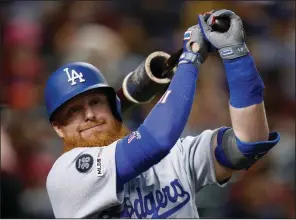  ?? (AP file photo) ?? Justin Turner of the Los Angeles Dodgers is among the older players who may benefit from the National League’s proposed use of the designated hitter this season.