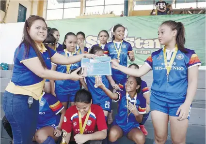  ?? SUNSTAR FOTO / ALEX BADAYOS ?? MVP. Cassandra Gillamac receives a special award from Sun Savings Bank for winning the MVP award in the Girls 16 division of the 7th SunStar Football Cup.