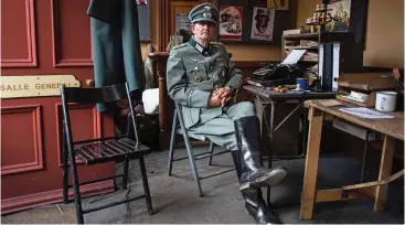  ??  ?? Assuming control: A Nazi officer makes himself at home at Levisham station in 2017