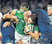  ??  ?? Gripping stuff: Johnny Sexton celebrates his try (right), while (left) Jamie Ritchie tackles Ireland’s Iain Henderson