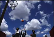  ?? PETROS KARADJIAS — THE ASSOCIATED PRESS FILE ?? Migrants play basketball on the deck of the Spanish NGO Open Arms lifeguard ship as they wait to get off the ship after docking at Messina port in Sicily, Italy, on Friday.