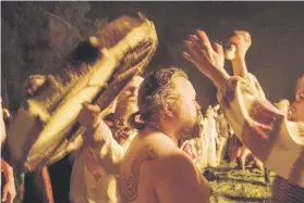  ?? Pictures: AFP ?? RITUAL. Russians dance around a bonfire to celebrate the summer solstice.