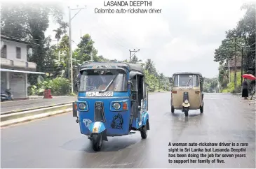  ?? ?? A womanauto-rickshaw driver is a rare sight in Sri Lanka but Lasanda Deepthi has been doing the job for seven years to support her family of five.