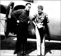  ?? Miami Herald/MCT ?? Amelia Earhart with her navigator Fred Noonan stand beside Earhart’s Lockheed Elecrta airplane. Earhart and Noonan disappeare­d on July 2, 1937, while flying over the central Pacific Ocean.