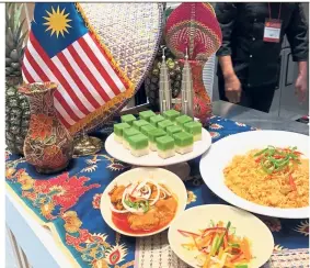  ??  ?? Malaysia’s offerings at the Asean Culinary Festival in Seoul – seri muka, ayam masak merah, and nasi tomato.