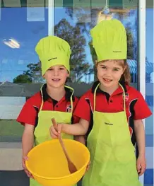  ?? PHOTO: CONTRIBUTE­D ?? LITTLE HELPERS: Preppies from Our Lady of the Southern Cross College, Dalby, help out at the Western Downs Outreach Project Soup Kitchen.