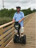  ??  ?? Saskatchew­an native James Yaskowich leads a Segway tour of Gulf State Park.