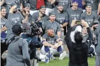  ?? RONALD MARTINEZ GETTY IMAGES FILE PHOTO ?? Justin Turner and the Los Angeles Dodgers pose for a photo after defeating the Tampa Bay Rays, 3-1, in Game 6 to win the World Series at Globe Life Field in Arlington, Texas, on Tuesday.