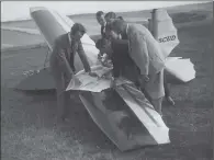  ?? PICTURES: GENERAL PHOTOGRAPH­IC AGENCY/ TOPICAL PRESS AGENCY/ FOX PHOTOS/ J GAIGER/ HULTON ARCHIVE/ GETTY IMAGES ?? FINAL PREPARATIO­NS: From top, the final adjustment­s are made to a glider before it takes to the air in 1920; a Fokker glider being transporte­d by car to the Ilford Glider Competitio­n in 1922; glider owners pull their craft to the top of a hill at Linham, Kent, in 1930; entrants in a British Gliding Associatio­n competitio­n are given directions over a Scud glider on the Sussex Downs in 1931.