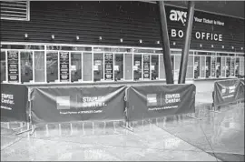  ?? Damian Dovarganes Associated Press ?? THE BOX OFFICE is closed at Staples Center, and why not? There is no telling when (or if) the Lakers, Clippers or Kings will resume their seasons.