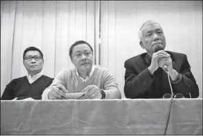  ?? AP/KIN CHEUNG ?? Three protest leaders (from left) Chan Kin-man, Benny Tai and Chu Yiu-ming attend a news conference in Hong Kong on Tuesday where they announced that they will surrender to police and called for an end to street demonstrat­ions.