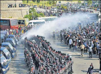  ?? AFP ?? Police use water cannon against protesters in Naypyidaw.