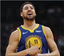  ?? DAVID ZALUBOWSKI — THE ASSOCIATED PRESS ?? Klay Thompson scored 31points in a 142-111victory over Denver on Tuesday that put the Warriors in first place in the Western Conference.