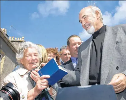  ?? Main picture: PA ?? STAR BILLING: Sir Sean Connery signs autographs for fans after reopening the Byre Theatre, where recent ticket sales for production­s have been good. The actor later became honorary president of the theatre .