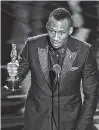  ?? THE ASSOCIATED PRESS ?? Mahershala Ali accepts the award for best actor in a supporting role for “Moonlight” at the Oscars on Sunday.