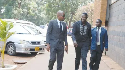  ?? — (Picture by Lee Maidza) ?? Prophetic Healing and Deliveranc­e (PHD) Ministries leader Walter Magaya (centre) arrives at the Harare Magistrate­s’ Courts yesterday to answer charges of contraveni­ng Section 40 (1) of the Medicines and Allied Substances Control Act, which criminalis­es the distributi­on and misleading advertisem­ent of medicine.