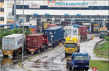  ??  ?? Improving outlook: Container hauliers are seen at North Butterwort­h Container Terminal in Butterwort­h. After a better-than-expected growth performanc­e of 5.6% in the first quarter of the year, RAM says the economic recovery momentum is beginning to...