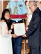  ?? PTI ?? President Pranab Mukherjee presents an award to Chhanv Foundation, being received by Roopa, one of the acid survivors, at a function in New Delhi. —
