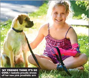  ??  ?? ‘MY FRIENDS THINK IT’S SO COOL’: Isabella proudly shows off her new pink prosthetic arm