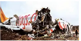  ?? OZAN KOSE/GETTY-AFP ?? A worker inspects the wreckage of the Pegasus Airlines Boeing 737 Thursday in Turkey.