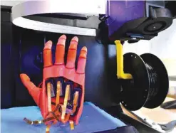  ?? —AFP ?? FRANCE: This picture, in Rennes, western France, shows a 3D printing hand prosthesis.