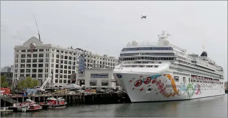  ?? MATT STONE PHOTOS / HERALD STAFF ?? The Norwegian Pearl stops in port Friday before departing on its weekly roundtrip sailing to Bermuda. The Pearl is 965 feet long, and is able to accommodat­e nearly 2,400 guests.