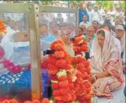  ?? HT PHOTO ?? CM Vasundhra Raje condoles the grieving family of MLA Dharampal Chaudhary in his native village Jat Behror.