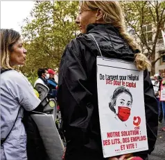  ?? FRANCOIS MORI/AP ?? A medical worker joins a protest Tuesday outside the Health Ministry in Paris against a law requiring them to get vaccinated or risk suspension. The law is aimed at protecting patients from new COVID-19 surges.